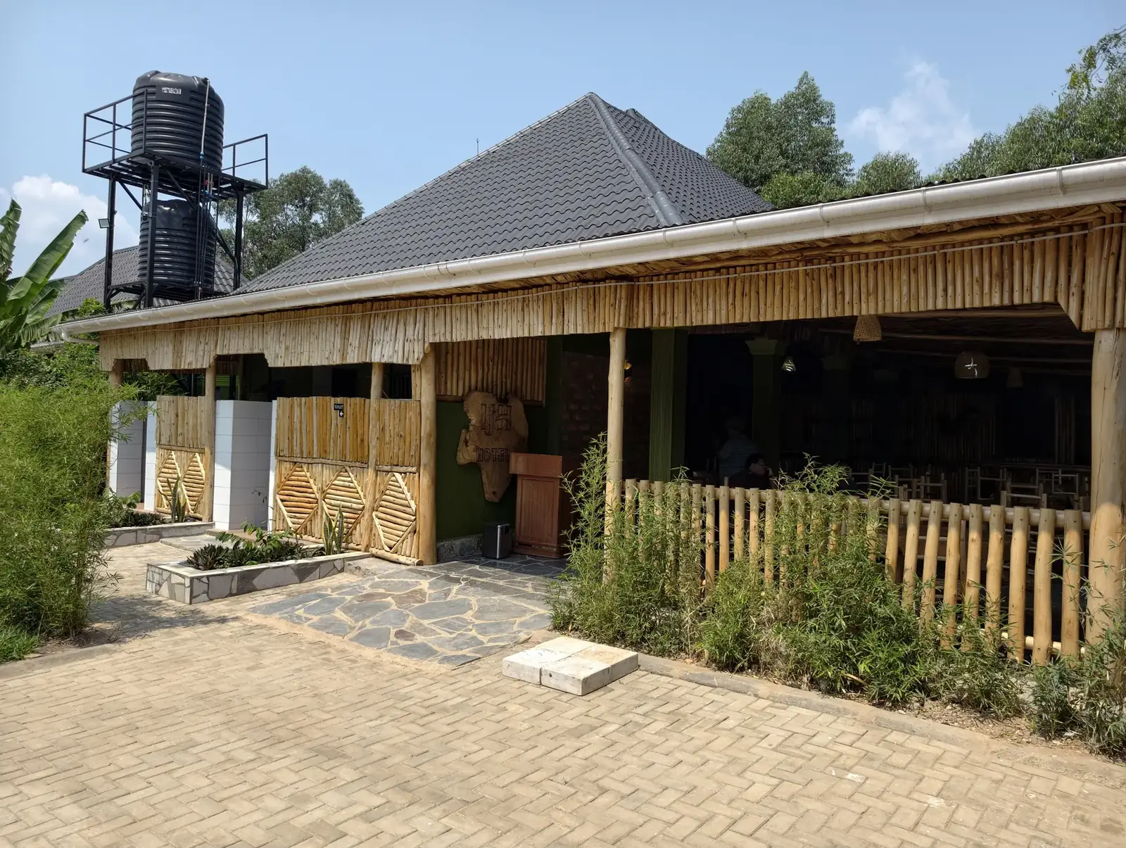 Bamboo-fronted entrance and restaurant at Ishasha Junction Hotel